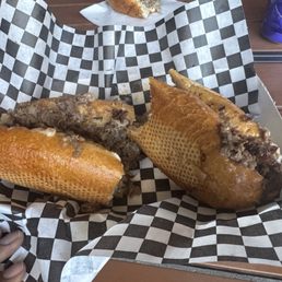 Cheesesteak with onions and bell peppers.
