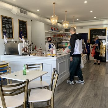 The Portuguese Bake Shop - a man standing at the counter - Bakeries Near Me - Etobicoke, Ontario