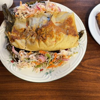 Antojitos Emanuel - Guatemalan pork tamale in a banana leaf with traditional cabbage Curtido on the side - delicious! - Latin American Near Me - Ridgeland, Mississippi