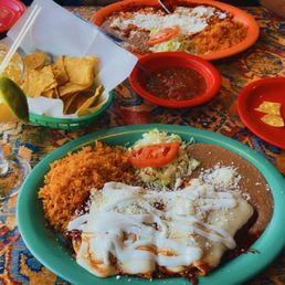 Enchiladas Suizas and Enchiladas Rojas with a mango margarita and complimentary chips and salsa