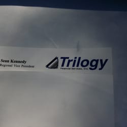 Trilogy Financial Services - Trilogy logo w/ name Sean Kennedy, RVP