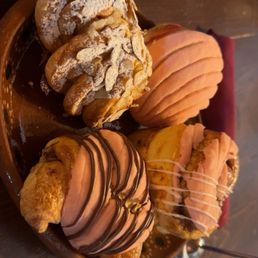 Arroz Con Leche Bear Claw, Concha Croissant stuffed with Nutella, Guava Stuffed Conchas, and concha cinnamon bun Arroz Con Leche Bear Claw, Concha Croissant stuffed with Nutella, Guava Stuffed Conchas, and concha cinnamon bun