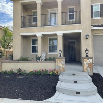 CR Pacific Landscape Design and Construction - Front yard: Custom built stairs with lights, custom wall with pillars and lights, drip line for plants. - Landscaping Near Me - Murrieta, California