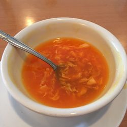 House of Hunan - Egg drop soup. Orange, almost red. Unnatural.