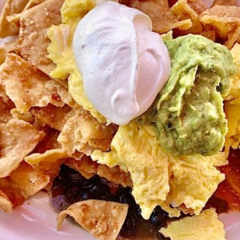 Millie's Cafe - Chilaquiles - tortilla chips with scrambled eggs , sour cream , guac, and black beans. - Breakfast & Brunch Near Me - Los Angeles, California Millie's Cafe - Chilaquiles - tortilla chips with scrambled eggs , sour cream , guac, and black beans. - Breakfast & Brunch Near Me - Los Angeles, California