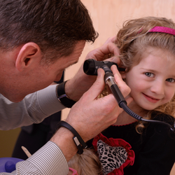 Derry Medical Center - Dr. John Welter examining one of his young patients