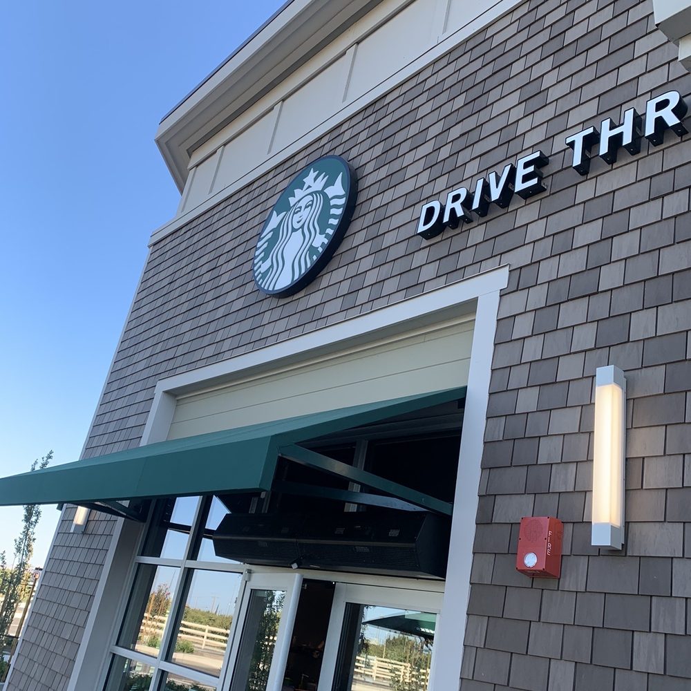 Starbucks - a starbucks drive thru sign on the side of a building - Coffee & Tea Near Me - Mountain House, California Starbucks - a starbucks drive thru sign on the side of a building - Coffee & Tea Near Me - Mountain House, California