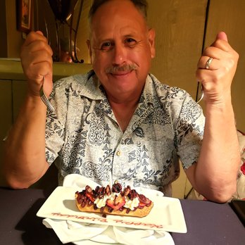 Antiquity Restaurant - Birthday man with Hungarian crepe for dessert - Seafood Near Me - Albuquerque, New Mexico Antiquity Restaurant - Birthday man with Hungarian crepe for dessert - Seafood Near Me - Albuquerque, New Mexico