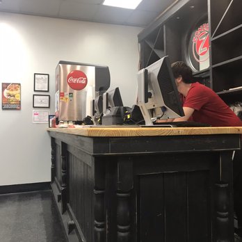 Zoner's Pizza - a man working at a counter - Chicken Wings Near Me - Rincon, Georgia Zoner's Pizza - a man working at a counter - Chicken Wings Near Me - Rincon, Georgia