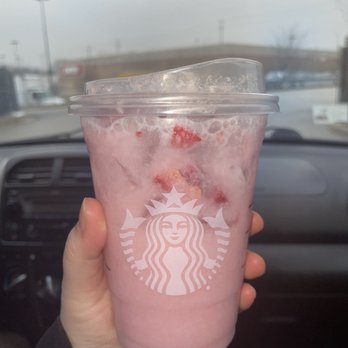 Starbucks - a hand holding a pink drink in a car - Coffee & Tea Near Me - Rolling Meadows, Illinois