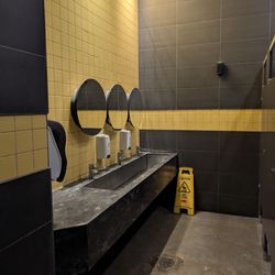 Sink area. You don't need to push a door to enter the women's washroom.