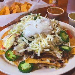 Speedy Taco - Steak & chorizo nachos - supreme - add fresh chopped onion and fresh sliced jalapeno.