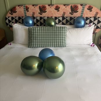 Wayfinder Waikiki - Birthday decorations on king sized bed - Hotels Near Me - Honolulu, Hawaii
