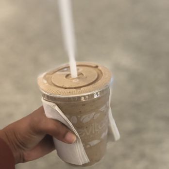 Revitasize - a hand holding a cup of coffee - Juice Bars & Smoothies Near Me - Toronto, Ontario Revitasize - a hand holding a cup of coffee - Juice Bars & Smoothies Near Me - Toronto, Ontario