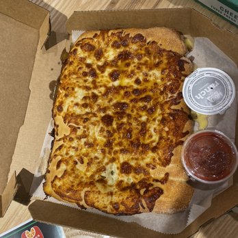 Marco's Pizza - a pizza in a box with a side of ketchup - Italian Near Me - Oviedo, Florida Marco's Pizza - a pizza in a box with a side of ketchup - Italian Near Me - Oviedo, Florida