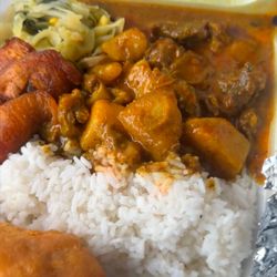Floyds Jamaican Jerk Chicken - Look at how rich the curry goat is and not everybody put potatoes in their curry goat and that right there is the# one thing