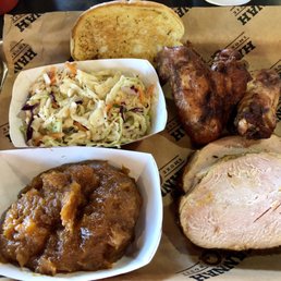 Two Meat Platter with Smoked Turkey & Smoked Wings. Sides of Sweet Potato Casserole and Cajun Slaw.
