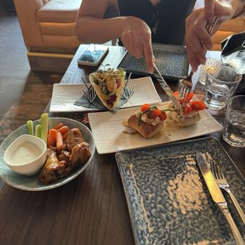 Paris Texas - From happy hour menu: Chicken wings, fish taco, goat cheese crustini - Sports Bars Near Me - Toronto, Ontario Paris Texas - From happy hour menu: Chicken wings, fish taco, goat cheese crustini - Sports Bars Near Me - Toronto, Ontario