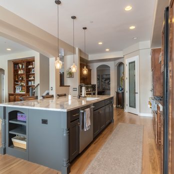 Arise Constructions & Remodels - a kitchen with a center island - General Contractors Near Me - Denver, Colorado