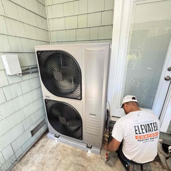 Elevated Comfort - An Elevated Comfort Installer finishes the final touches on a Heat Pump Installation. - Heating & Air Conditioning/HVAC Near Me - Cotati, California Elevated Comfort - An Elevated Comfort Installer finishes the final touches on a Heat Pump Installation. - Heating & Air Conditioning/HVAC Near Me - Cotati, California