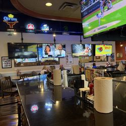 Pluckers Wing Bar - Selma - Inside seating and the sports tv