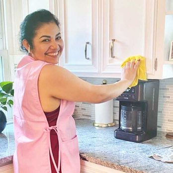 QC Cleaning - Cleaning a kitchen and wiping down cabinets. - Home Cleaning Near Me QC Cleaning - Cleaning a kitchen and wiping down cabinets. - Home Cleaning Near Me