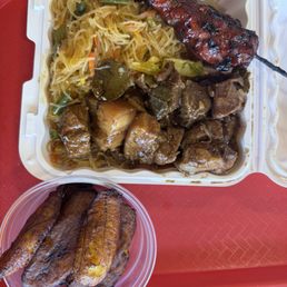 Pork adobo and pancit with a chicken skewer and plantains Pork adobo and pancit with a chicken skewer and plantains