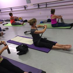 Studio Darien Pilates - Seated twist - usually practiced on the Reformer
