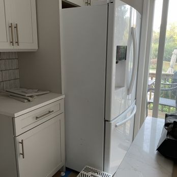 Incredible Builders - "Finished" installed cabinets and fridge. There is about 6" between the island and fridge. - General Contractors Near Me - Huntley, Illinois Incredible Builders - "Finished" installed cabinets and fridge. There is about 6" between the island and fridge. - General Contractors Near Me - Huntley, Illinois