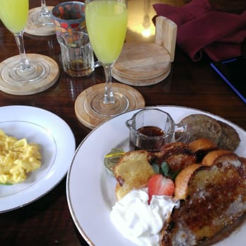 Candlelight - French toast, a side of scrambled eggs, and a side of sausage patties. And a mimosa, YUM! - Coffee & Tea Near Me - San Antonio, Texas
