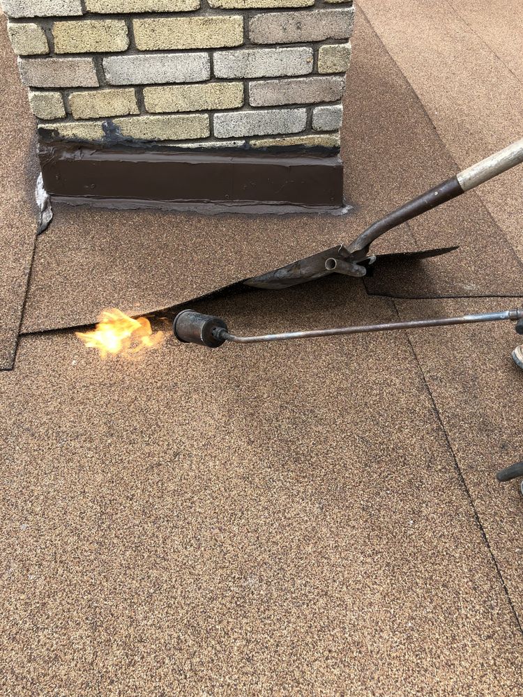 Slide of The Roofing Pros