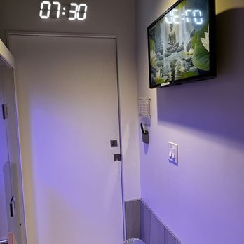 SweatHouz Infrared Sauna Studio - TV (across from sauna) and a clock above the door to help you keep track of your time - Saunas Near Me - Atlanta, Georgia SweatHouz Infrared Sauna Studio - TV (across from sauna) and a clock above the door to help you keep track of your time - Saunas Near Me - Atlanta, Georgia