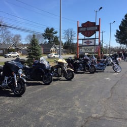 Spitzie's Harley Davidson - Company sign with some of the bikes