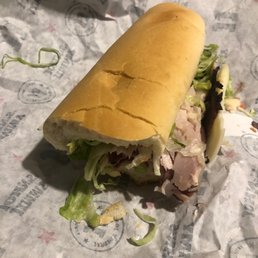 a sub sandwich on a wrapper a sub sandwich on a wrapper