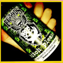 a hand holding a can of beer a hand holding a can of beer