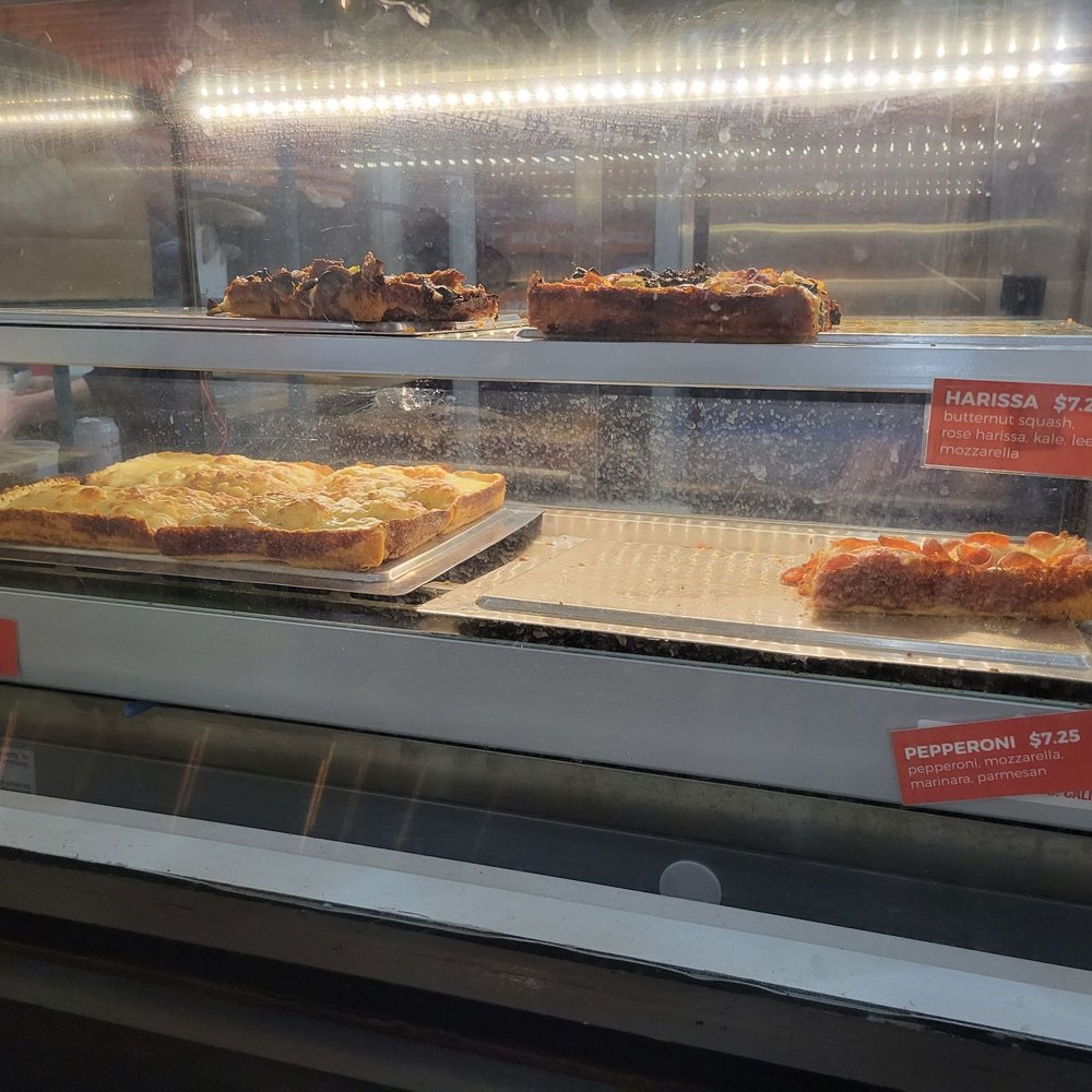 Wild Child Pizza - Slices in case - Pizza Near Me - Portland, Oregon