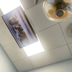 Riccobene Associates Family Dentistry - TV on the ceiling while getting worked on.