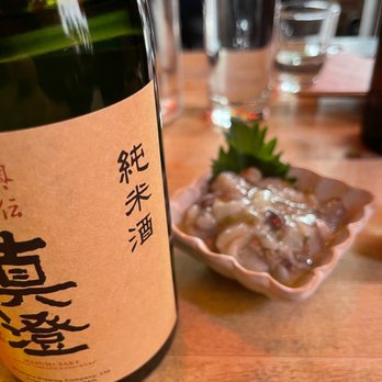 Sake Bar Satsko - a bottle of sake sitting on a table - Bars Near Me - New York, New York Sake Bar Satsko - a bottle of sake sitting on a table - Bars Near Me - New York, New York
