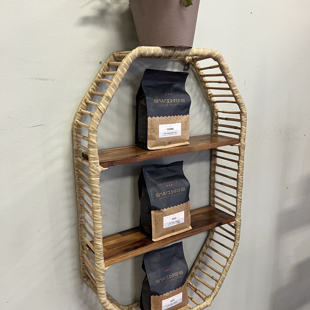 Sylvan Cafe & Restaurant  - a shelf with coffee bags and a potted plant - Cafes Near Me - Washington, DC, District of Columbia