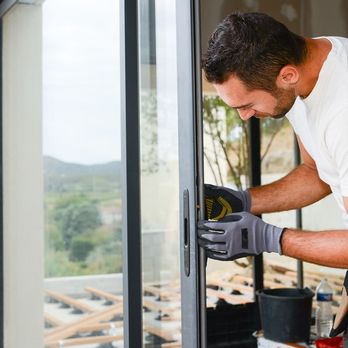 Holy City Home Solutions - a man working on a window - Handyman Near Me Holy City Home Solutions - a man working on a window - Handyman Near Me