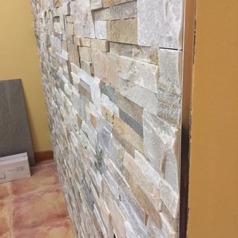 Prestige Installations - a view of a stone wall - Flooring Near Me