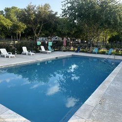Colorado Landing RV Park - Swimming pool with lounge chairs