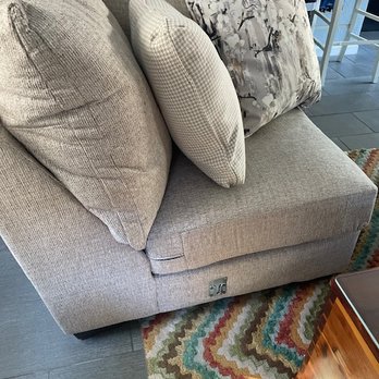 Conn's HomePlus - big silver clip on end of sofa - Furniture Stores Near Me - Austin, Texas