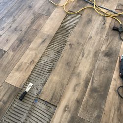 Mill Creek Carpet & Tile - Pulling up hollow sounding tiles
