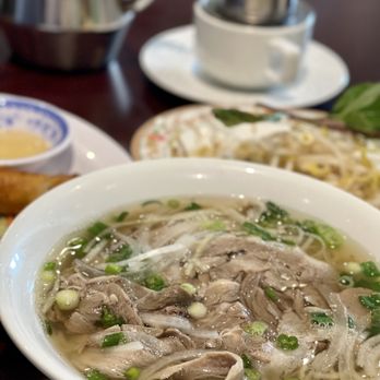 Pho Mi T&T - a bowl of soup and a plate of bread - Vietnamese Near Me - Burlington, Ontario