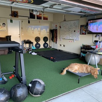 TRI-CITY Turf - Turf with cushioning installed over cement on the double bay side of the garage. - Artificial Turf Near Me TRI-CITY Turf - Turf with cushioning installed over cement on the double bay side of the garage. - Artificial Turf Near Me