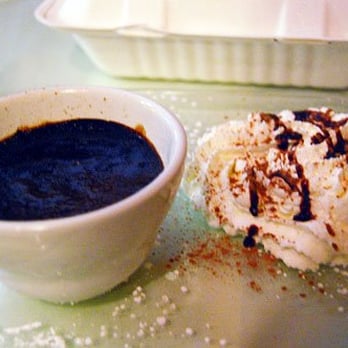 La Rustica - Chocolate creme brulee, served with a mound of fresh whipped cream.  May not look like much, but it's heaven in your mouth. - Italian Near Me - Seattle, Washington