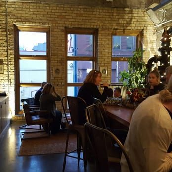 Vikre Distillery - interior, several high tables and a couple lower seating areas - Distilleries Near Me - Duluth, Minnesota