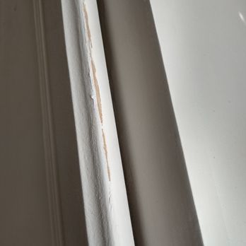 Complex Construction - a close up of a window sill - General Contractors Near Me