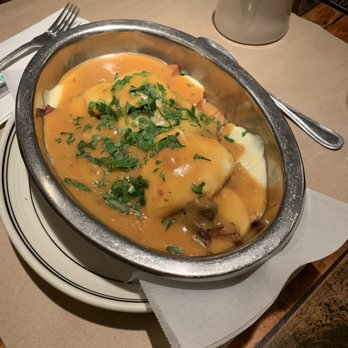 The Beehive - Poutine topped with short rib and poached eggs - American Near Me - Boston, Massachusetts The Beehive - Poutine topped with short rib and poached eggs - American Near Me - Boston, Massachusetts